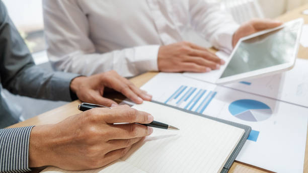istock Business team brainstorming and discussing with financial data and report graph. Teamwork meeting working concept. 1191195233