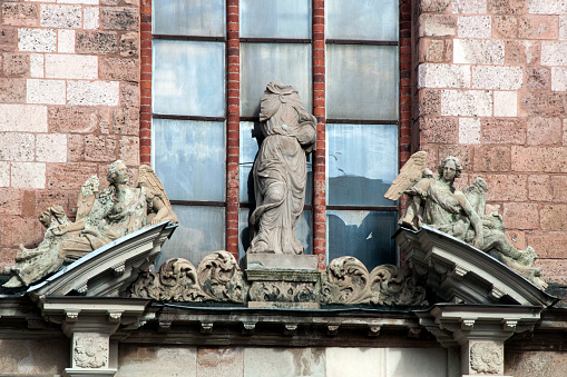 Statues and detail over entrance of the Church of Saint Peter facade in the old town