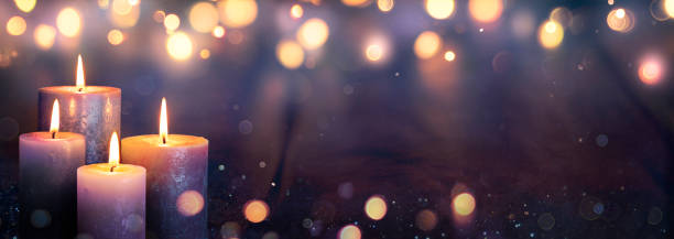 istock Advent - Four Purple Candles With Mystery Lights 1191196407