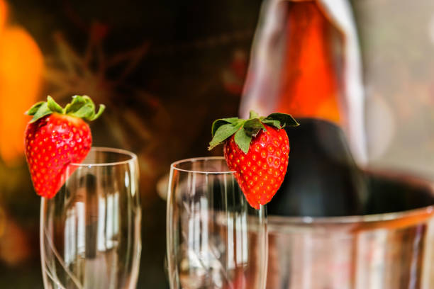 A glass with the champagne, decorated with a strawberry. Romantic composition with champagne and strawberry