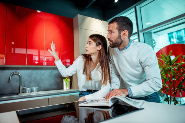 young couple planning together their new kitchen in a home diy store - lifestyles designer store luxury imagens e fotografias de stock