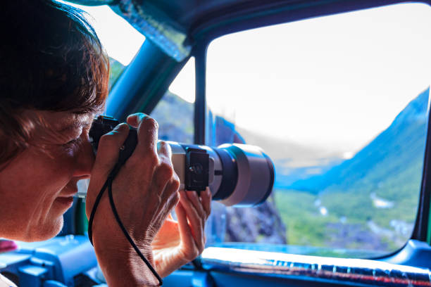 istock Photographer taking photo from camper car 1191199960