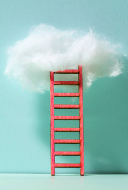 istock Red ladder to the clouds metaphor. Concept for growth and internet cloud networking. 1191200332