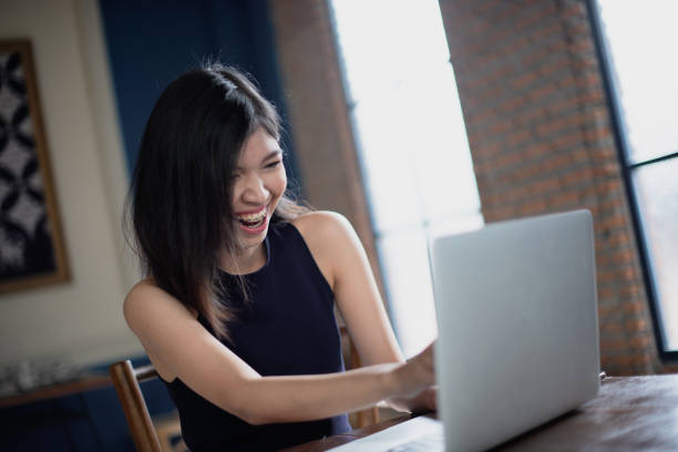 istock Asian freelance girl feeling happiness with her work. 1191202799