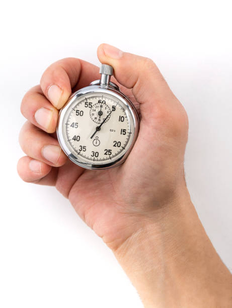 istock Man hand holding stopwatch isolated on white background 1191203412