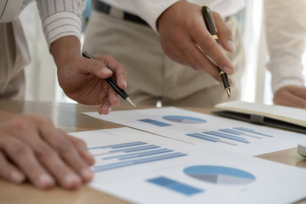 istock Business team brainstorming and discussing with financial data and report graph. Teamwork meeting working concept. 1191208212