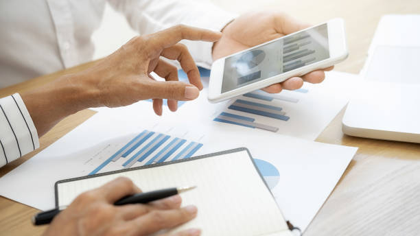 istock Business team brainstorming and discussing with financial data and report graph. Teamwork meeting working concept. 1191208221