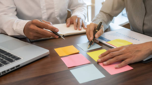 istock Business team brainstorming and discussing with financial data and report graph. Teamwork meeting working concept. 1191208515