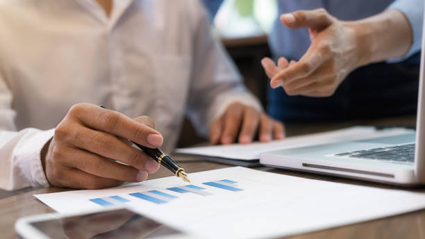 istock Business team brainstorming and discussing with financial data and report graph. Teamwork meeting working concept. 1191208520
