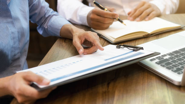 istock Business team brainstorming and discussing with financial data and report graph. Teamwork meeting working concept. 1191208530