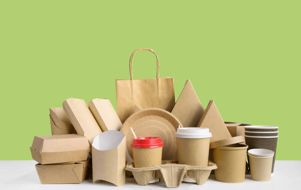 istock Fast food packaging from eco friendly paper isolated on green. 1191208585