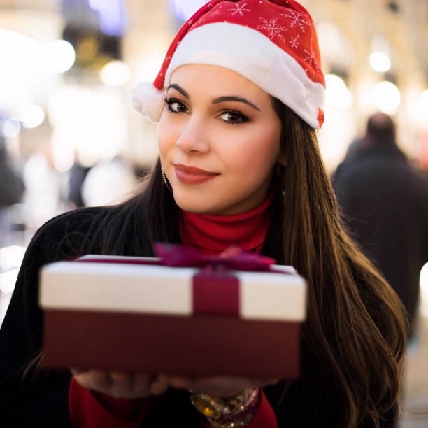 istock Young woman giving you a gift for Christmas 1191209430