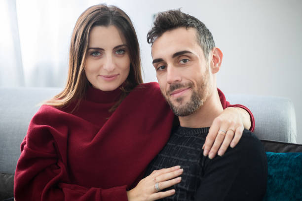istock Young couple on the sofa in love 1191209756