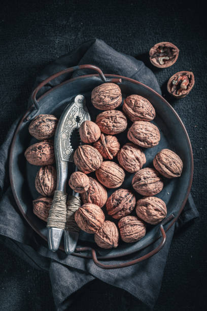 istock Tasty walnuts with on rustic metal plate 1191211065