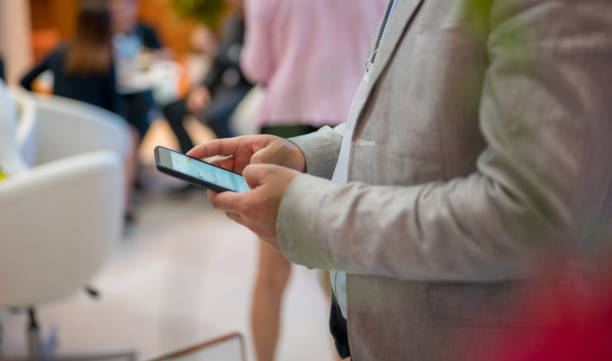 istock Close-up of a businessman using mobile phone 1191211111