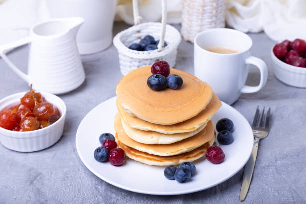 istock Pancakes with blueberries, cherries and jam from mini apples. 1191212189