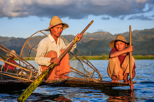 Fisherman posing on Inle Lake. Leg-rowing fishermen on Inle Lake are a major tourist destination in Myanmar (Burma).