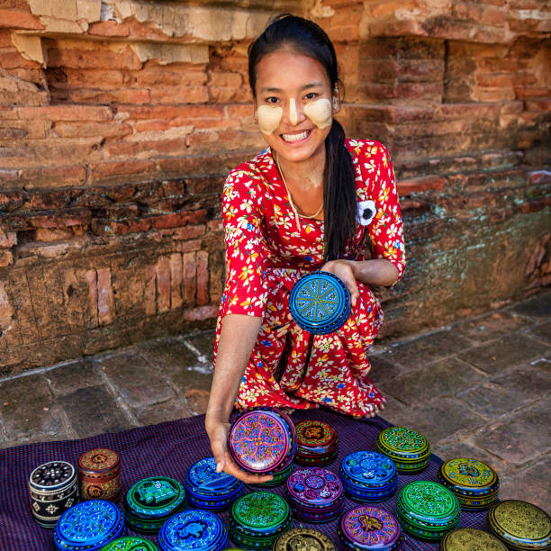 istock Young Burmese girl selling a lacquerware in Bagan, Myanmar 1191213591