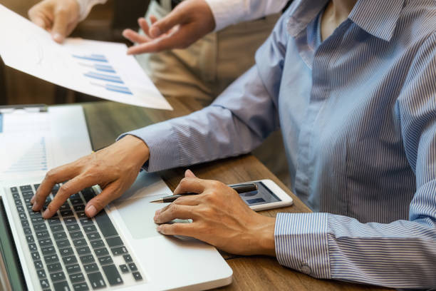 istock Business team brainstorming and discussing with financial data and report graph. Teamwork meeting working concept. 1191214321