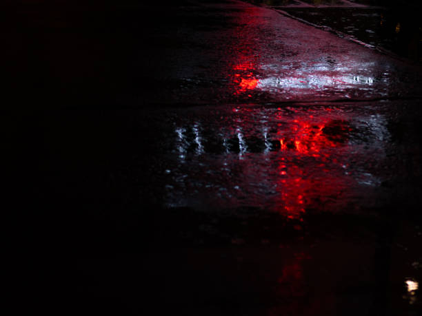 istock City light rain night reflection red white 1191215102