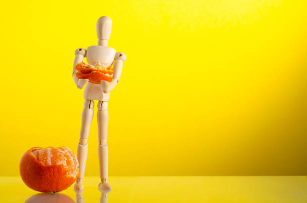 istock wooden man figure peel mandarin 1191215724