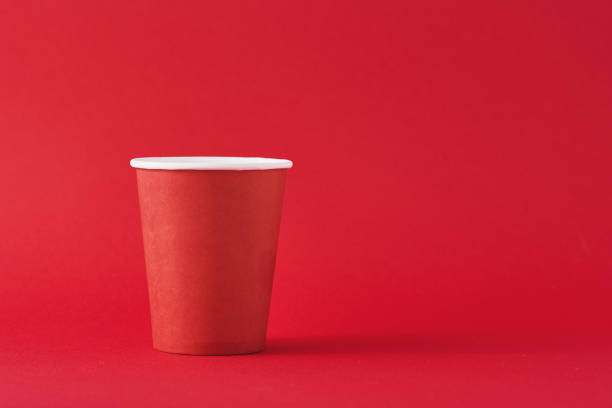 istock Red paper coffee cup on red background with a copy space. Minimalism style 1191215746