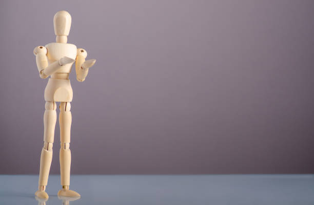 istock wooden man holding empty on gray background 1191215773