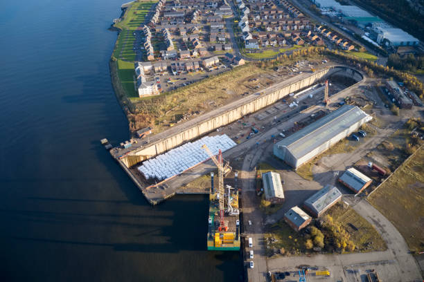 Drydock for shipbuilding construction industry aerial view at a dry dock in Greenock Scotland UK Drydock for shipbuilding construction industry aerial view at a dry dock in Greenock Scotland govan stock pictures, royalty-free photos & images
