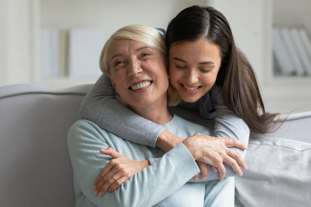 istock Grown up daughter strong cuddle loving 60s mother 1191216481