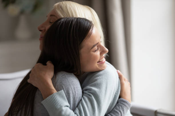 istock Close up image grown up daughter hugging elderly mother 1191216491