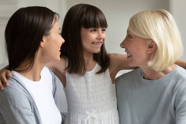 istock Three generation relatives women spend time together at home 1191216504