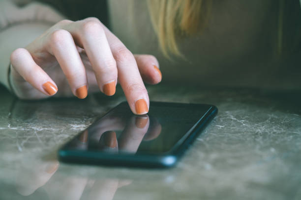 istock Woman using smart phone at cafe 1191217662
