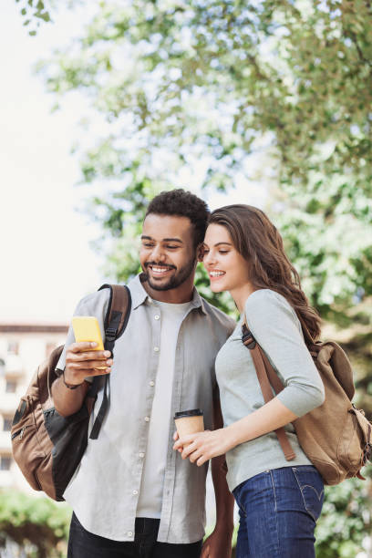 istock Beautiful happy couple using smartphone 1191218994