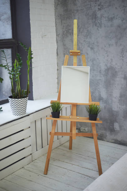 istock The artist's Studio in the loft .Bright room with a large window, easel 1191222493