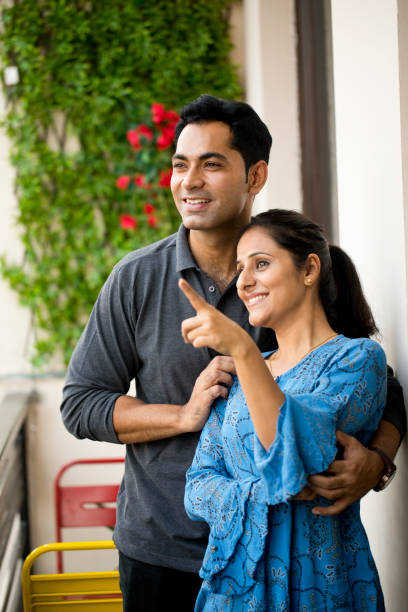 istock Couple admiring view from balcony 1191222816