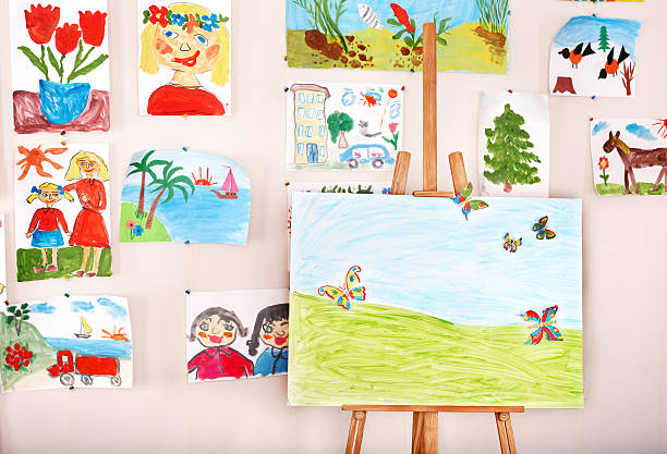 istock An easel surrounded by artwork made by children in art class 119122388