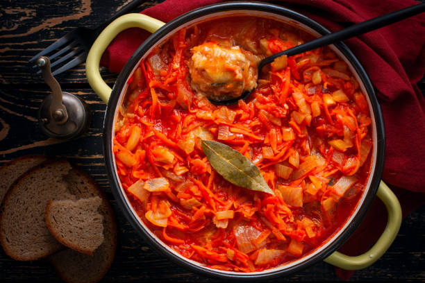 istock Pollock in tomato marinade with onions and carrots in a round shape, selective focus, top view 1191225839