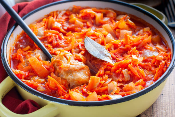 istock Pollock in a tomato marinade with onions and carrots in a round shape, selective focus 1191225873