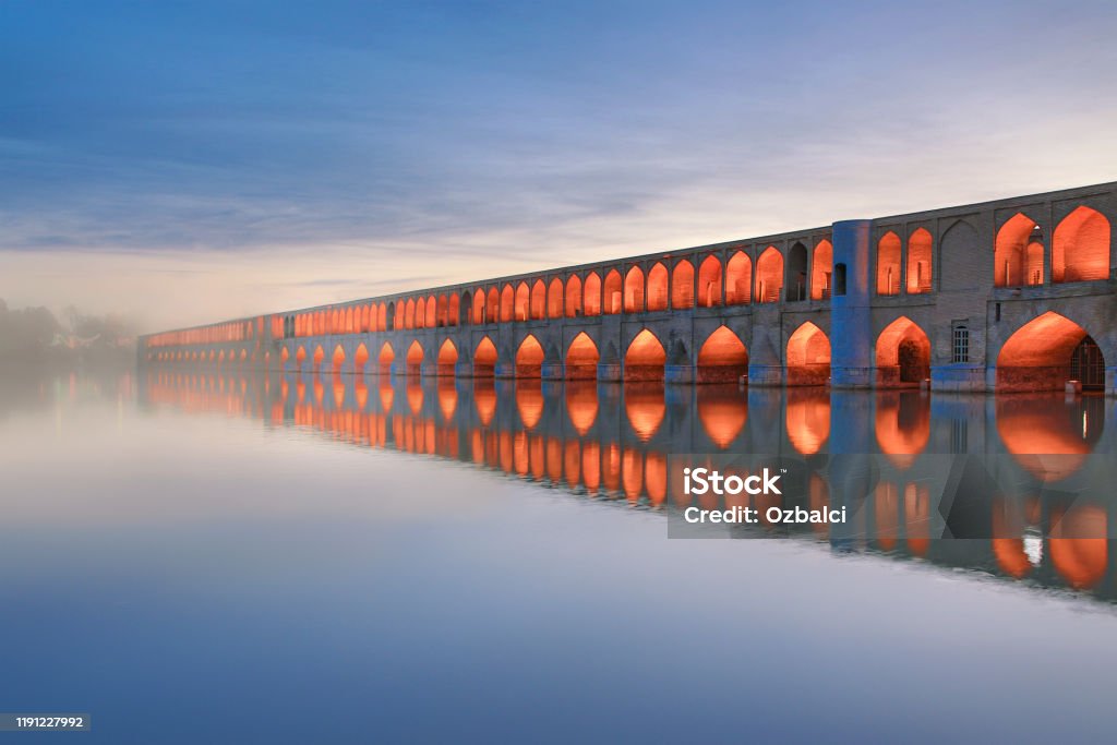 Historic Siosepol Bridge, Isfahan, Iran Historical Siosepol Bridge in Isfahan and its reflection in water, Iran Iran Stock Photo