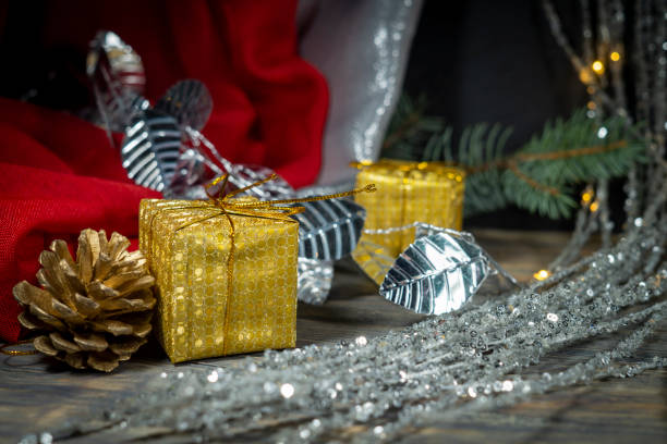 istock Festive Christmas background with golden gift 1191228071