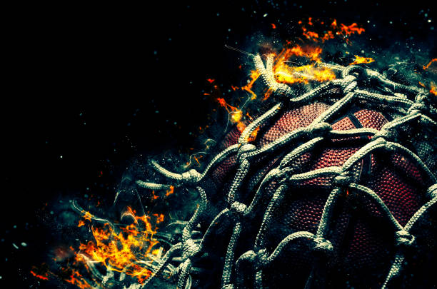 Basketball ball on black background with fire stock photo