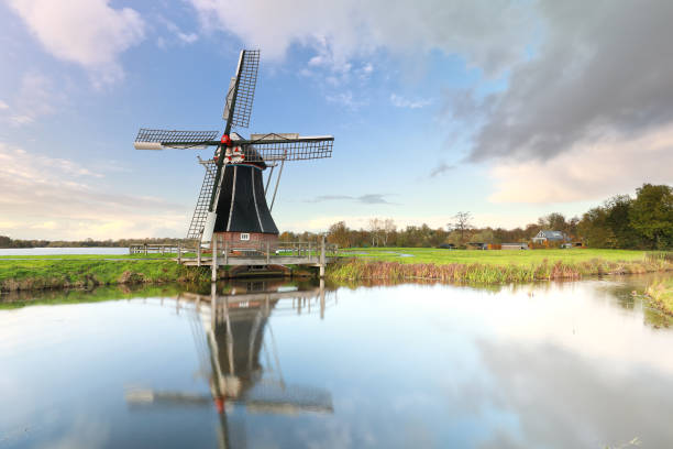 istock Dutch windmill by small lake, Holland 1191229201