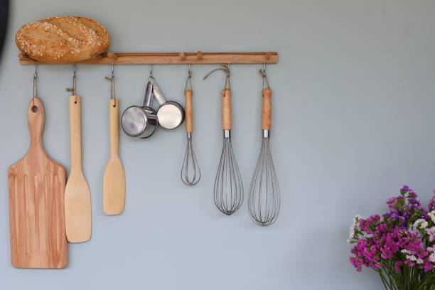 istock cooking kitchenware hanging on wall in kitchen room 1191229324