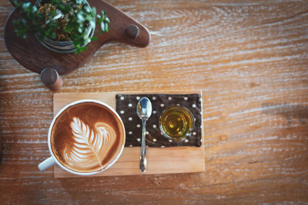istock hot latte coffee drink put on wooden table in cafe restaurant 1191229381