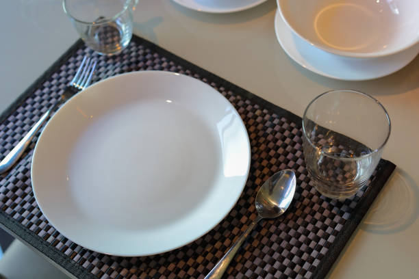 istock white dish ware sets arrange on dinner table inside eating room of modern home interior 1191229462