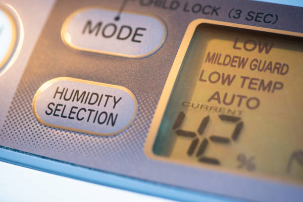 Air Purifier and dehumidifier. Concept for dehumidifying room. Humidity selection button. Humidity percentage display. Air Purifier and dehumidifier. Concept for dehumidifying room. Humidity selection button. Humidity percentage display. Close-up device. humidity photos stock pictures, royalty-free photos & images