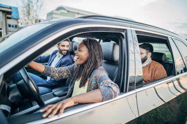 istock Happy friends driving in a car 1191231853