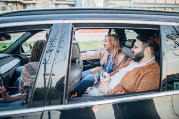 istock Cheerful friends sharing a car 1191232749