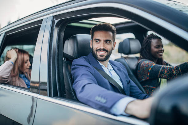 istock Cheerful friends driving in a car 1191232798