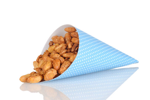 istock spilled honey covered peanuts in blue paper cone 1191233412